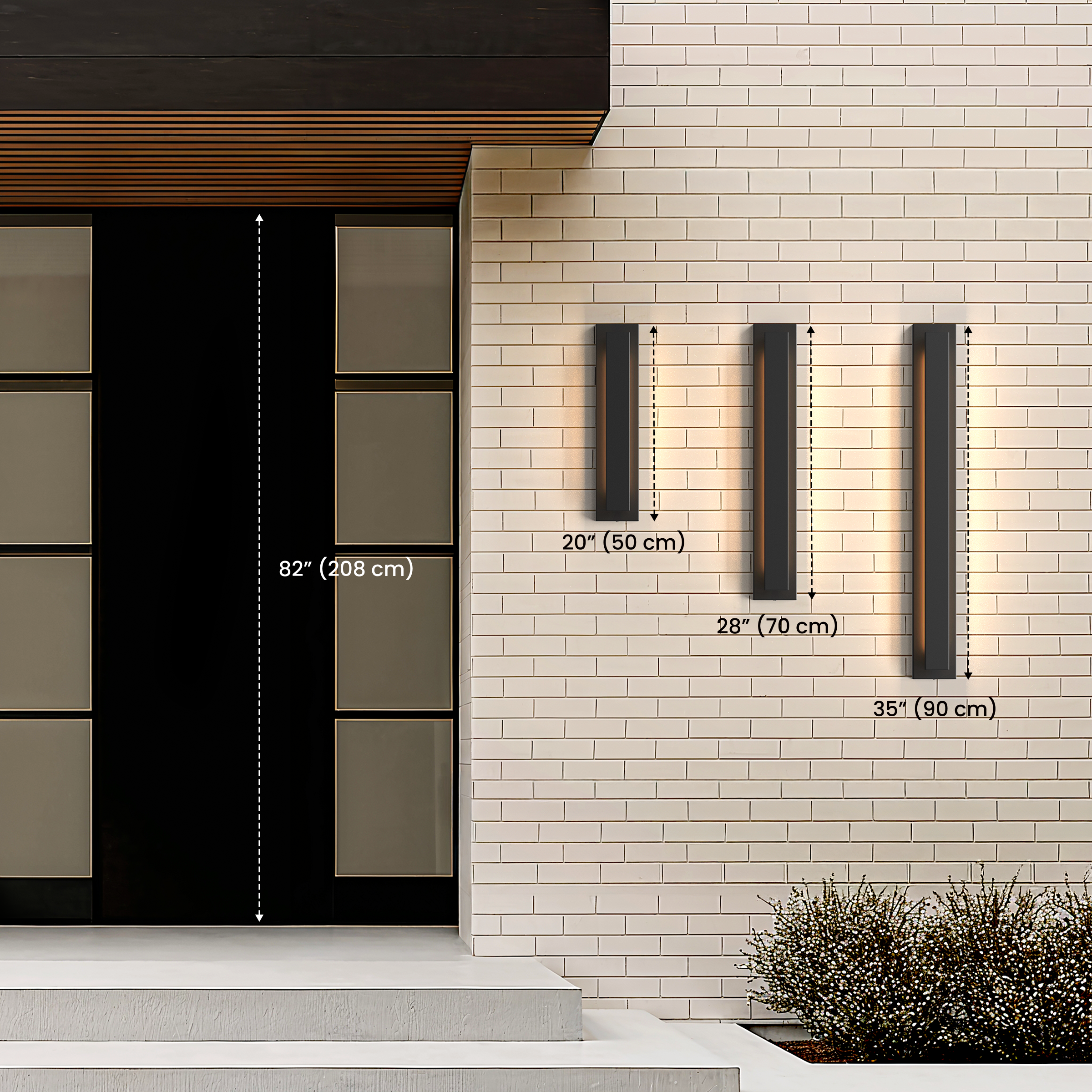 Three sizes of Vetra black outdoor sconces on brick, diagram noting 20 in / 50 cm, 28 in / 70 cm and 35 in / 90 cm