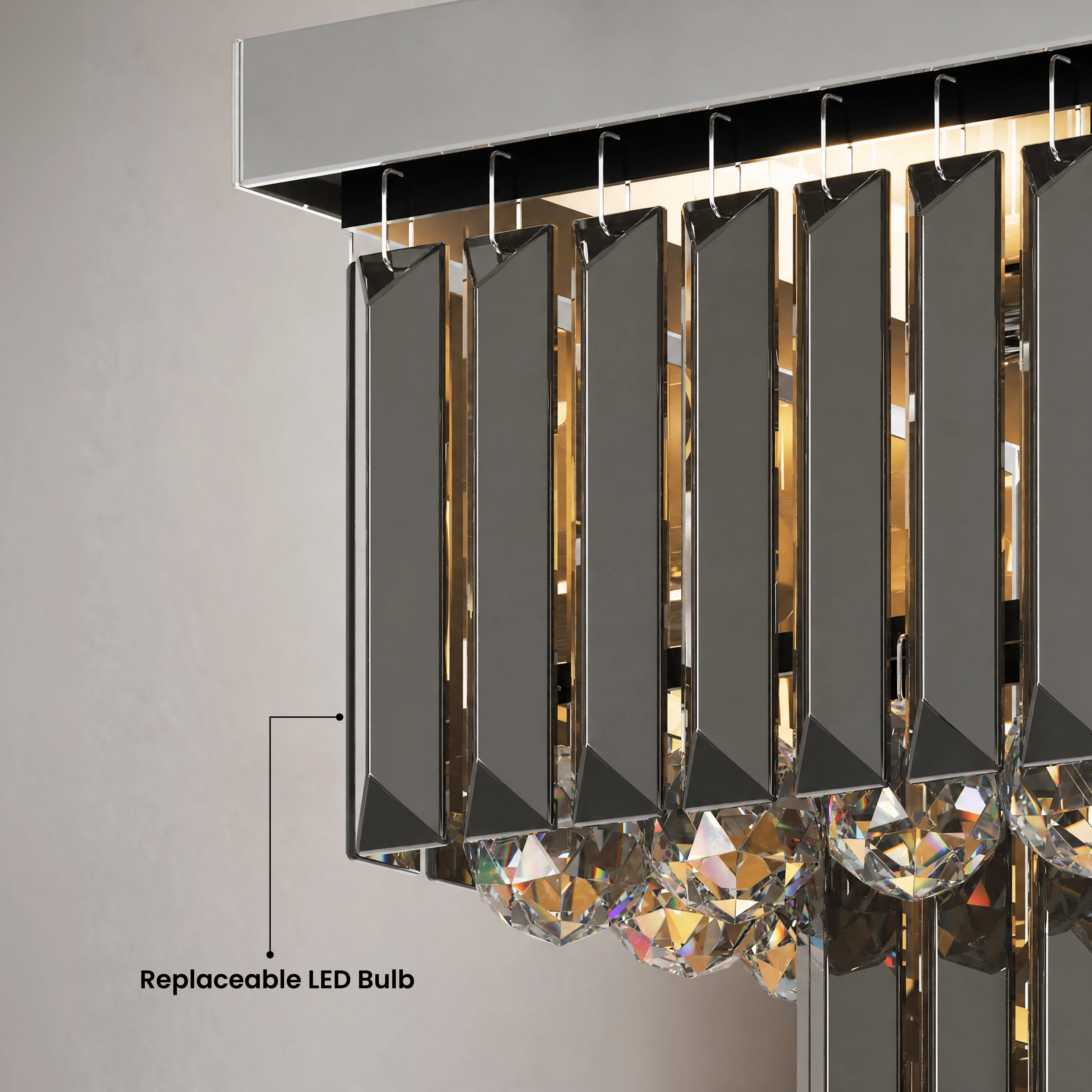 Umbra smoke-grey crystal chandelier over a bed in a dark bedroom, warm white 3000K, three sizes