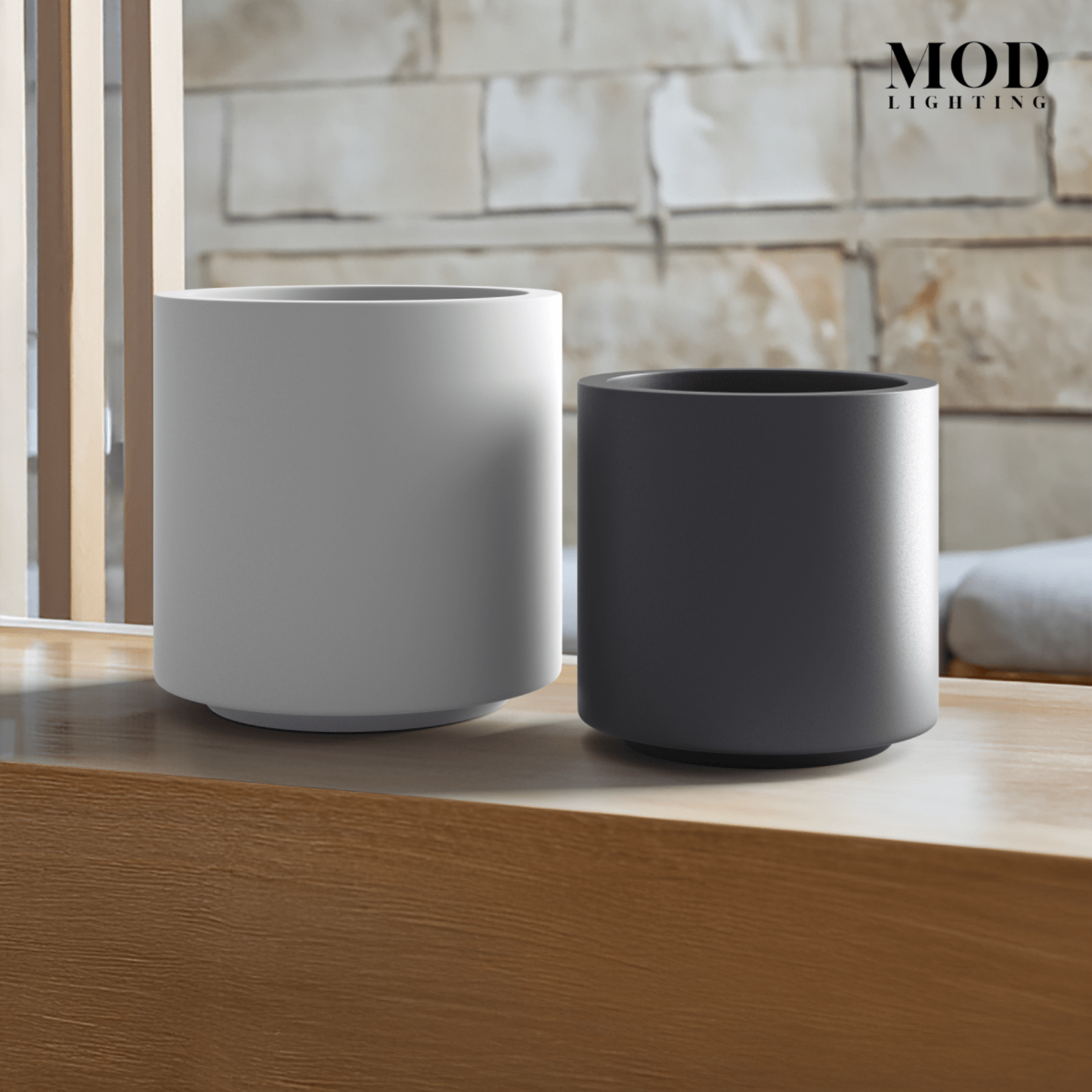Plant Pot, two matte cylindrical planters in white and dark grey on a wood ledge