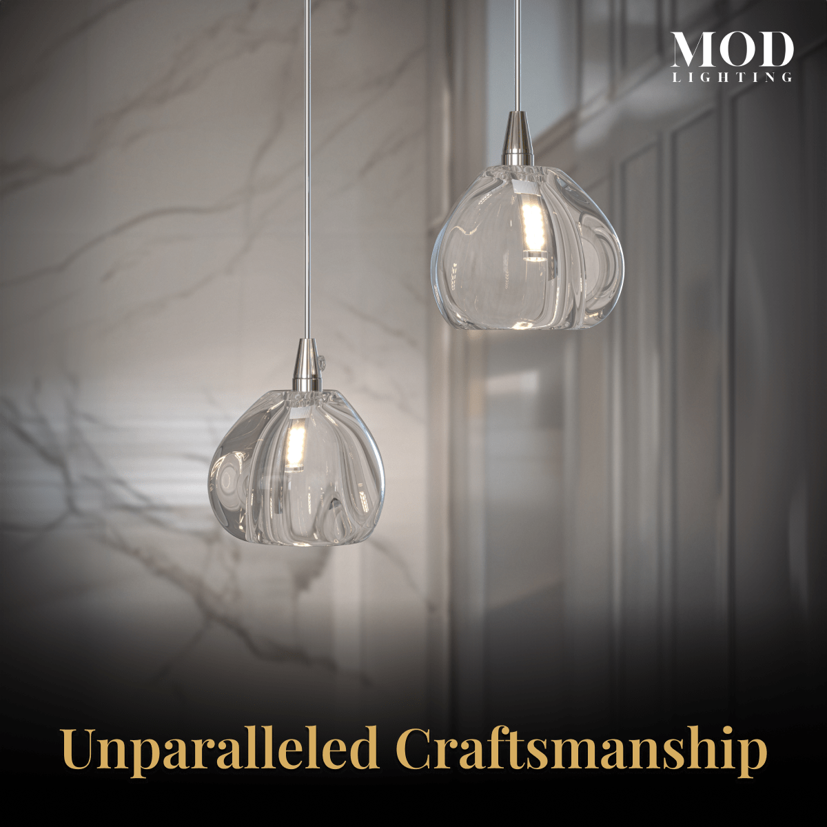 Sage clear ribbed-glass globe pendants, close view of two rounded shades against a marble wall