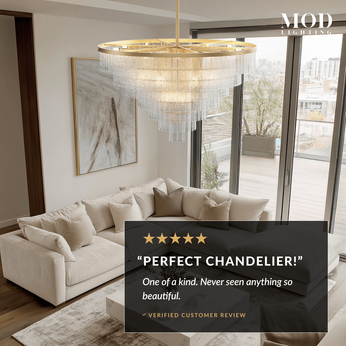 Cascade brass chandelier with tiered textured-glass fringe hanging in a bright modern living room