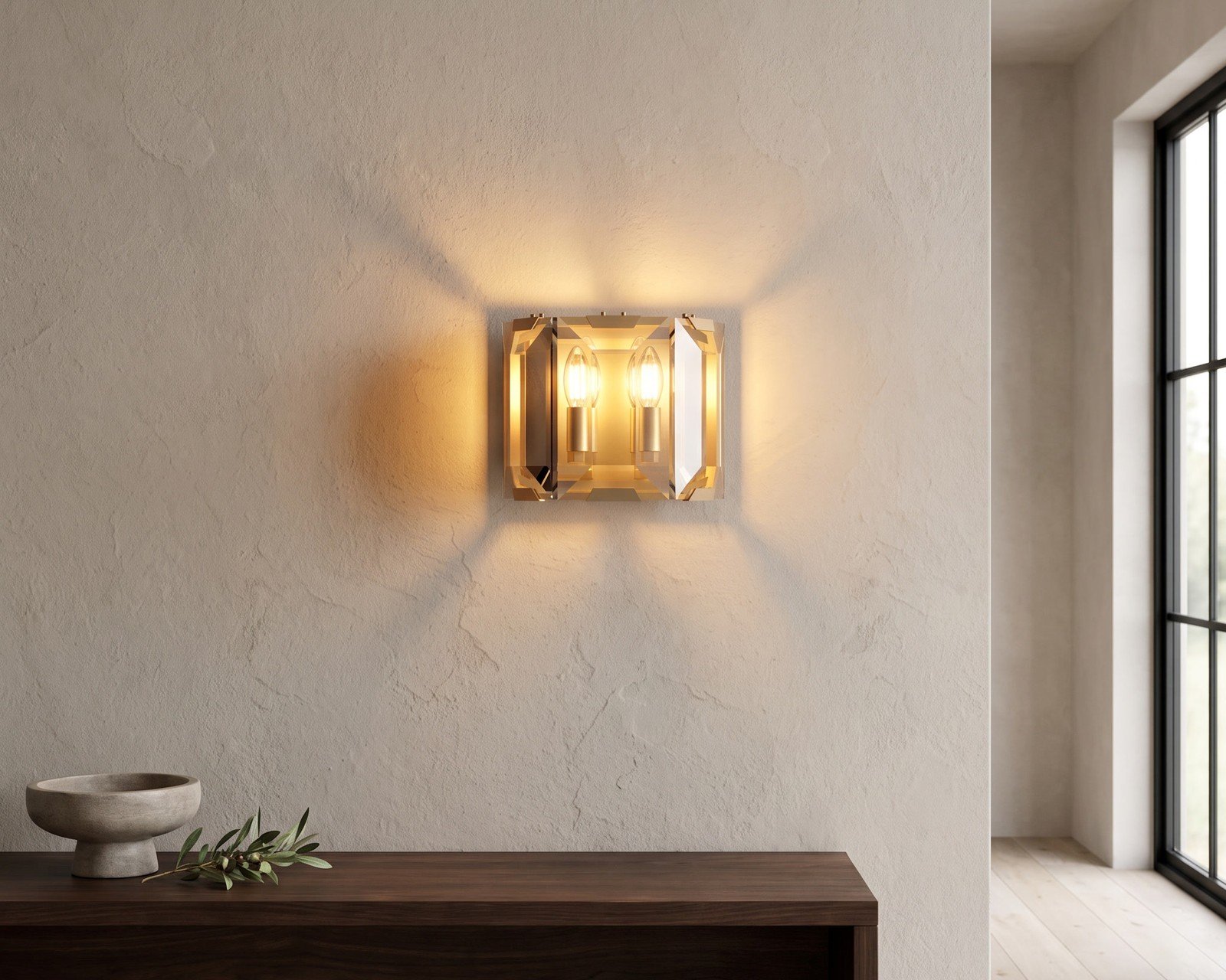 Solara Sconce, a gold and cut-glass wall sconce, in an entry