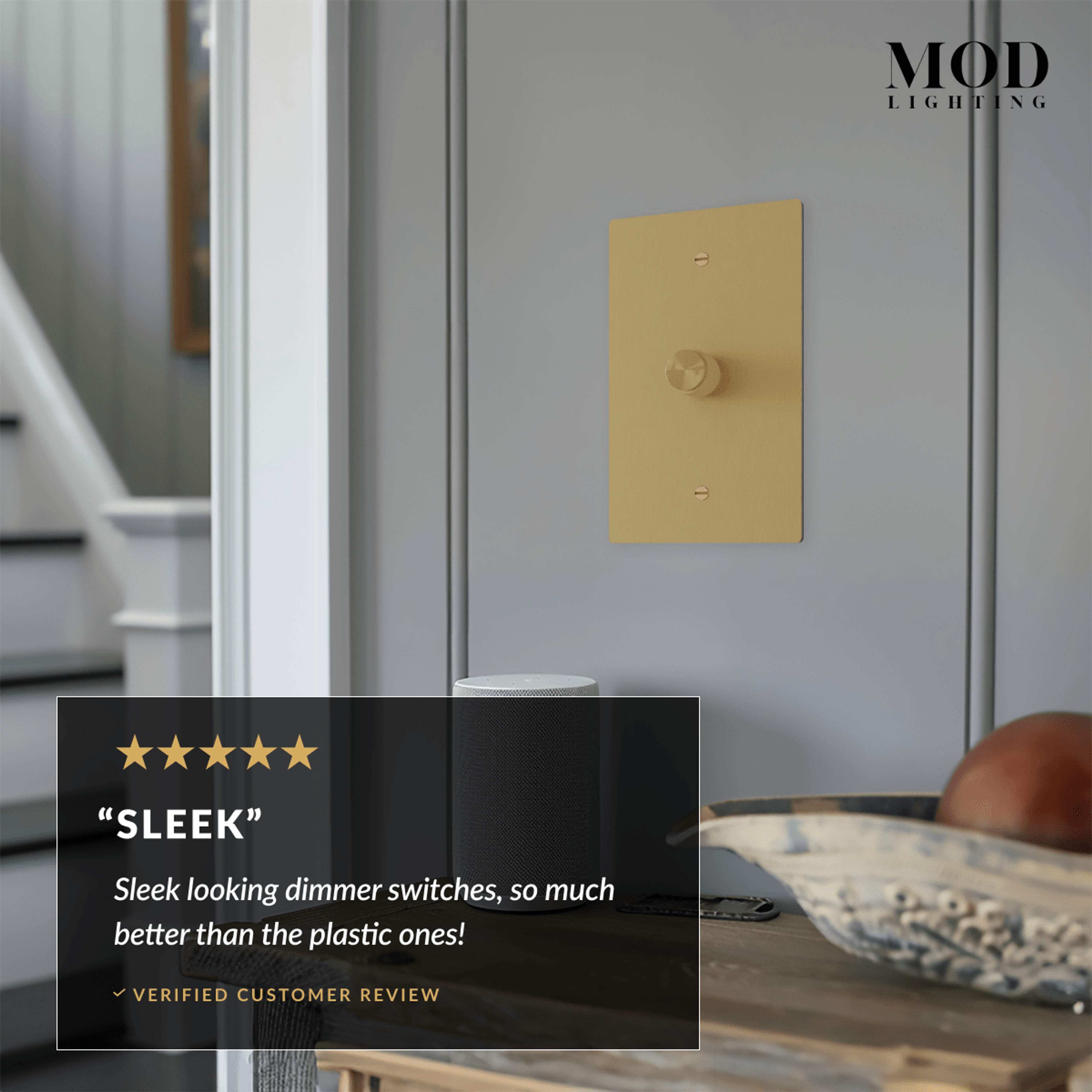 Modern Dimmer Switch, brushed-gold plate with rotary knob on a paneled wall, with review callout