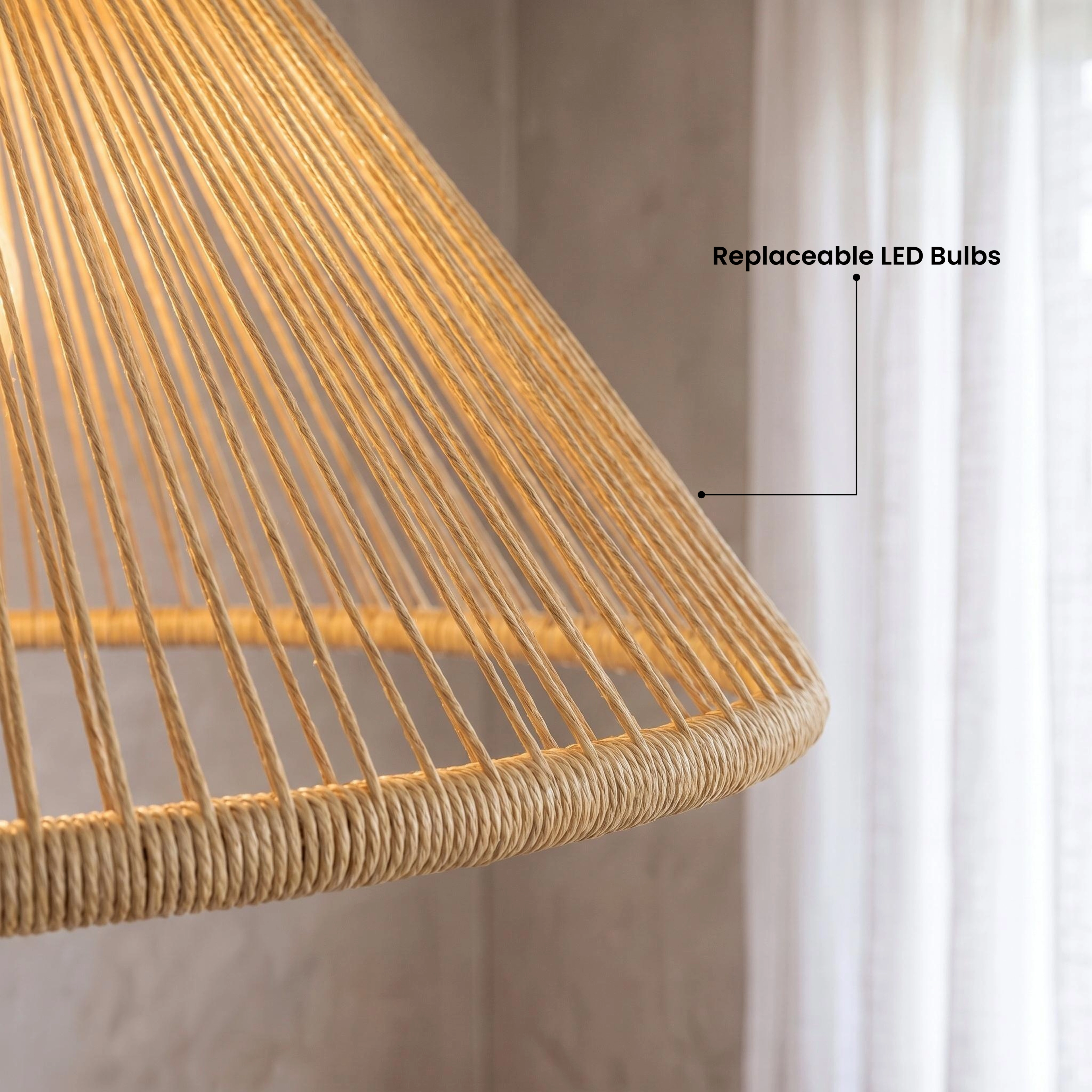 Isla hemp rope pendant, flared hourglass cone form, over a kitchen island in warm white, 3000K