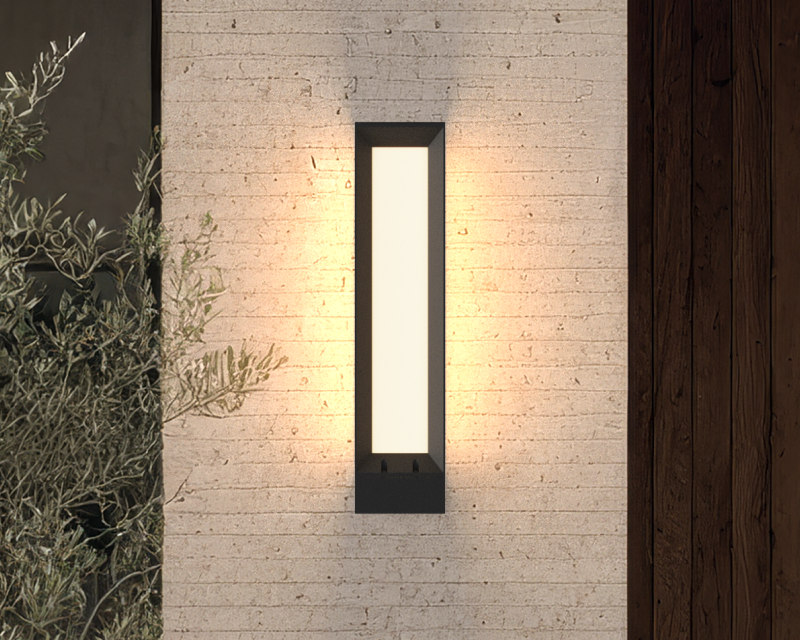 Ember, a black frame solar wall sconce, on a stucco facade
