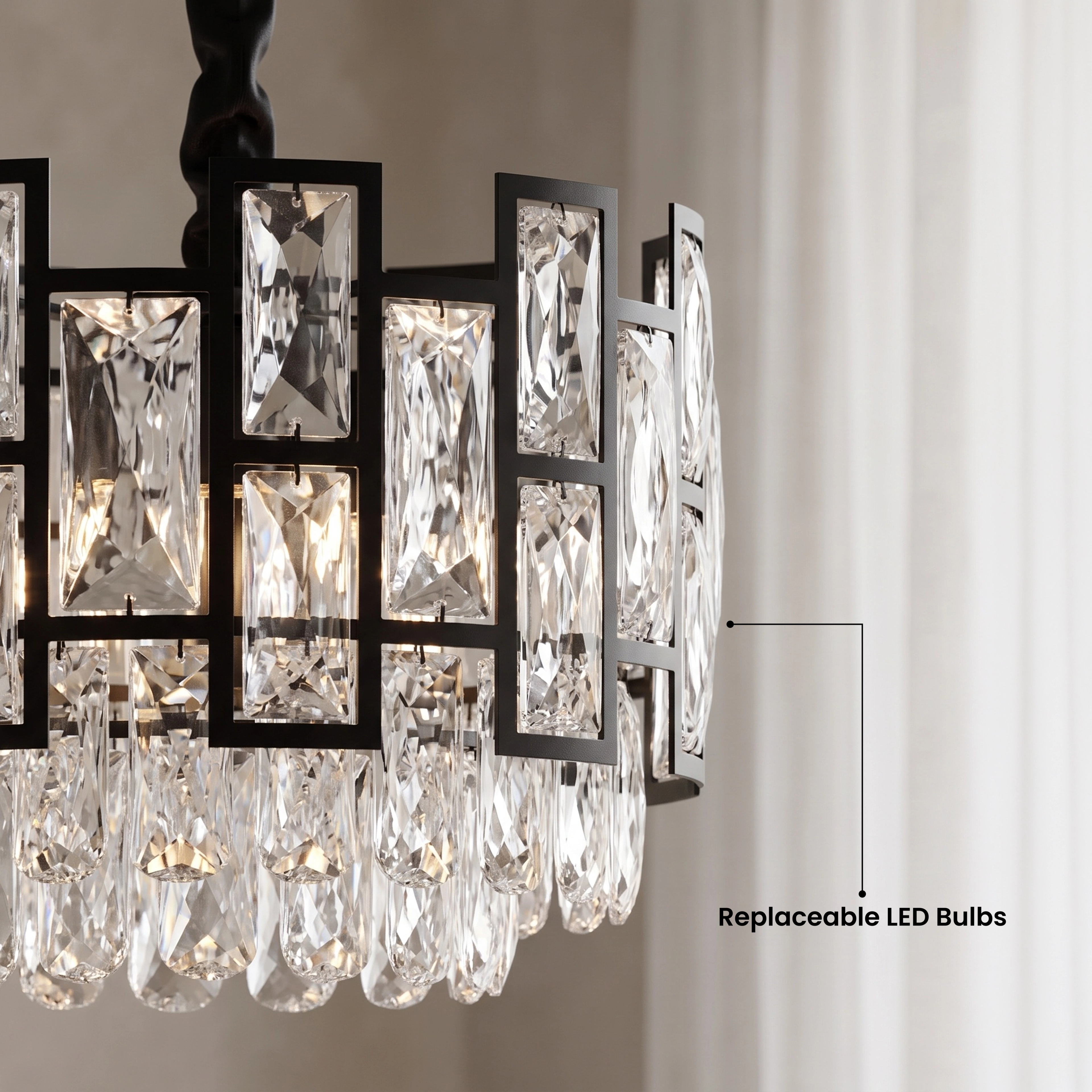 Mini Raven black crystal pendant pair in a dark kitchen, warm white 3000K, over a dining table