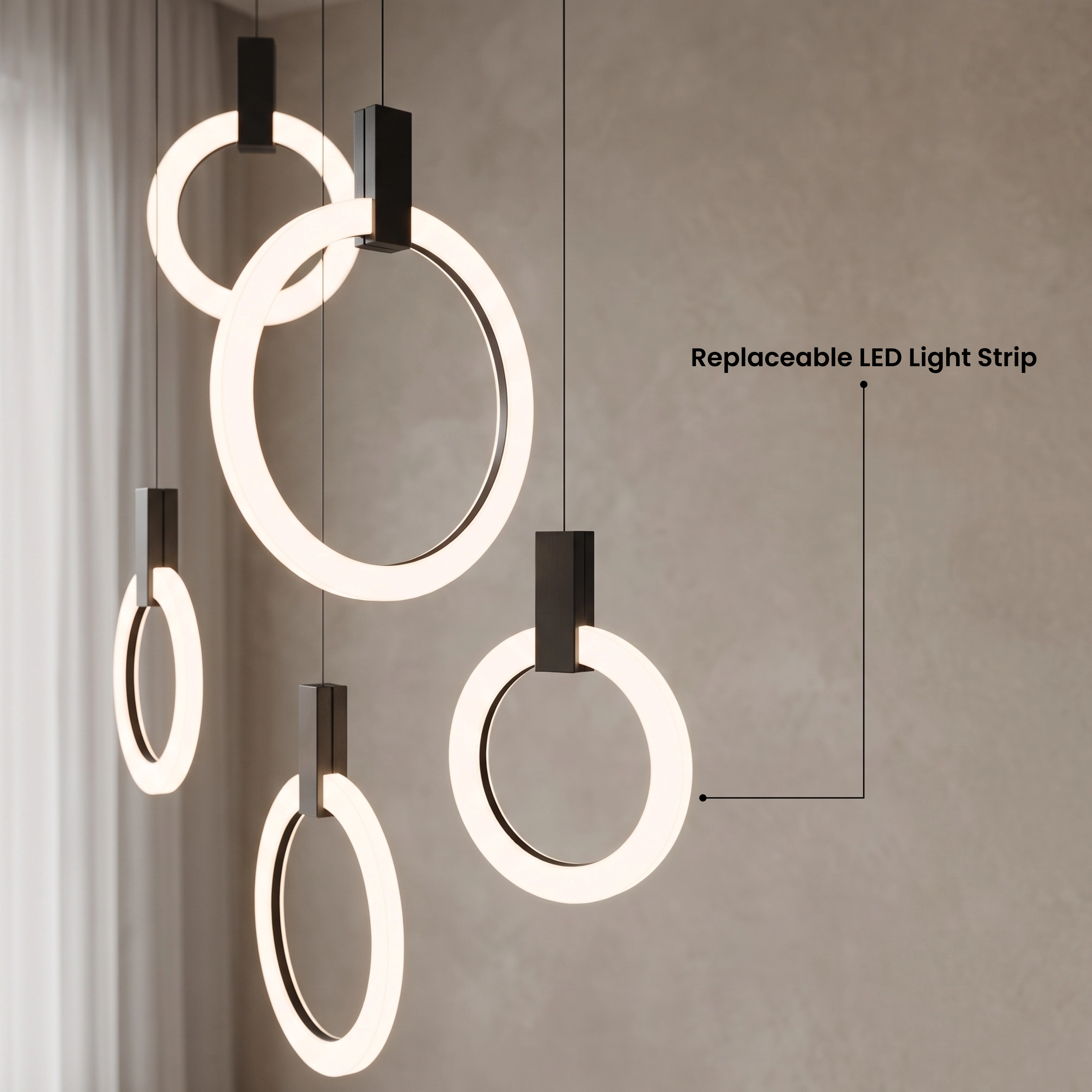 Skyla chandelier, warm white 3000K lit rings cascading against a marble feature wall over a sofa