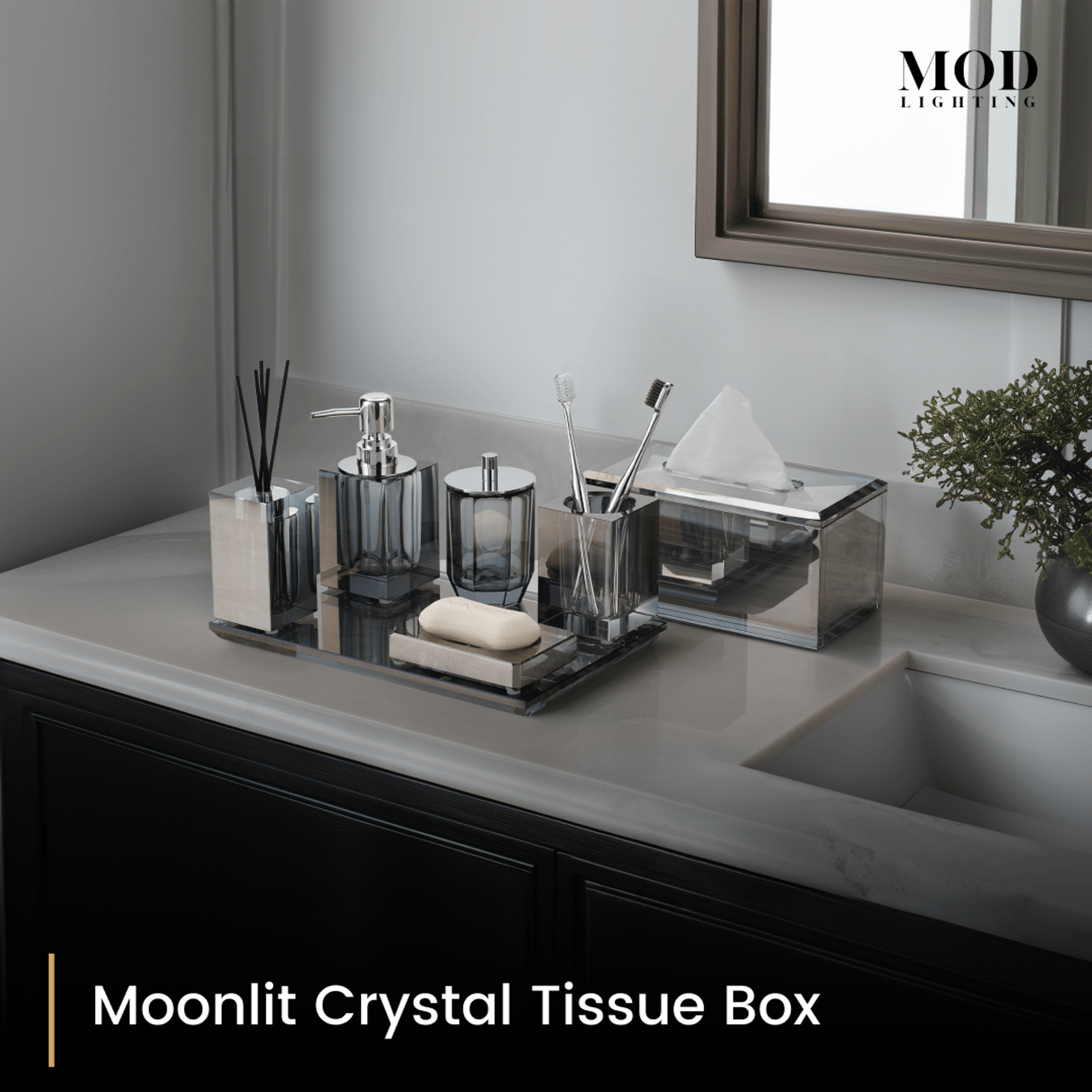 Moonlit Crystal Tissue Box with smoky crystal bath set on a mirrored tray on a dark vanity by an undermount sink