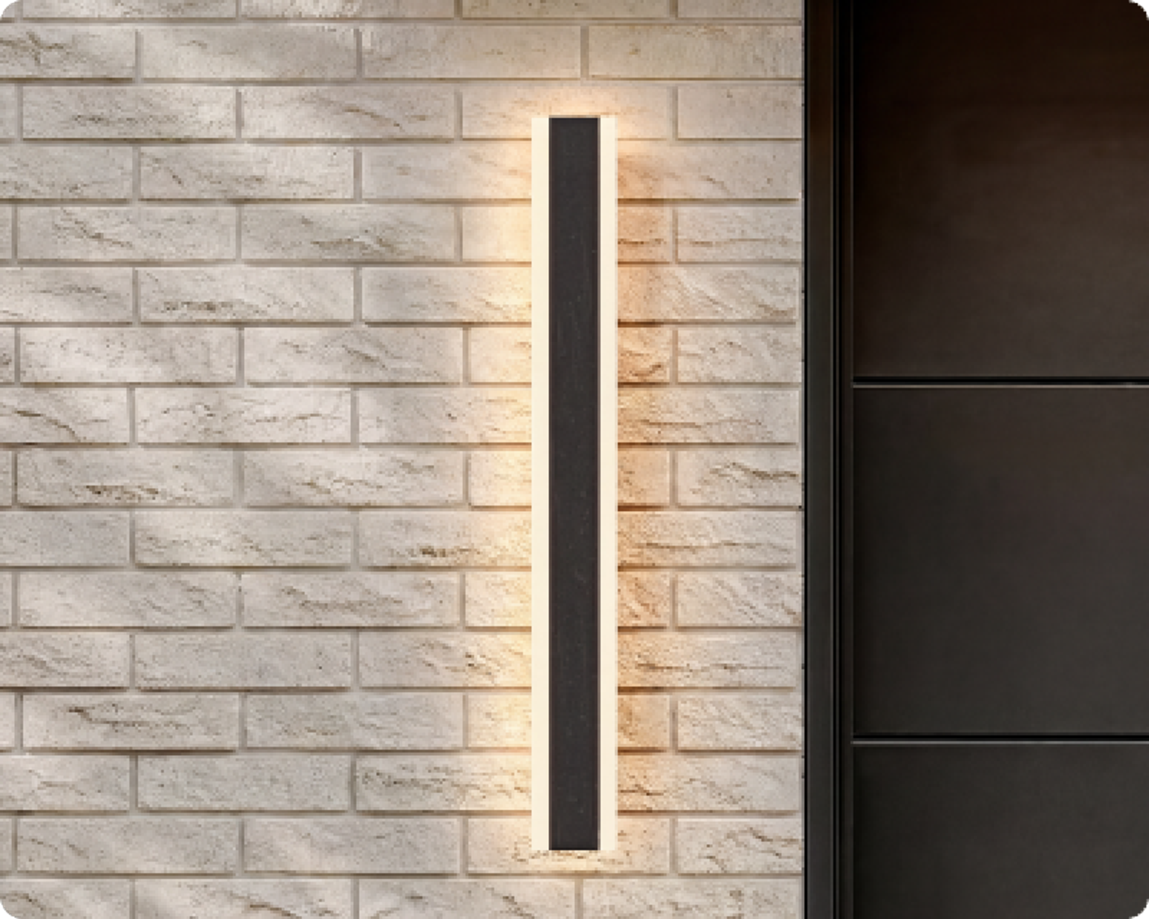 Haylen, a linear LED wall light, on a brick facade