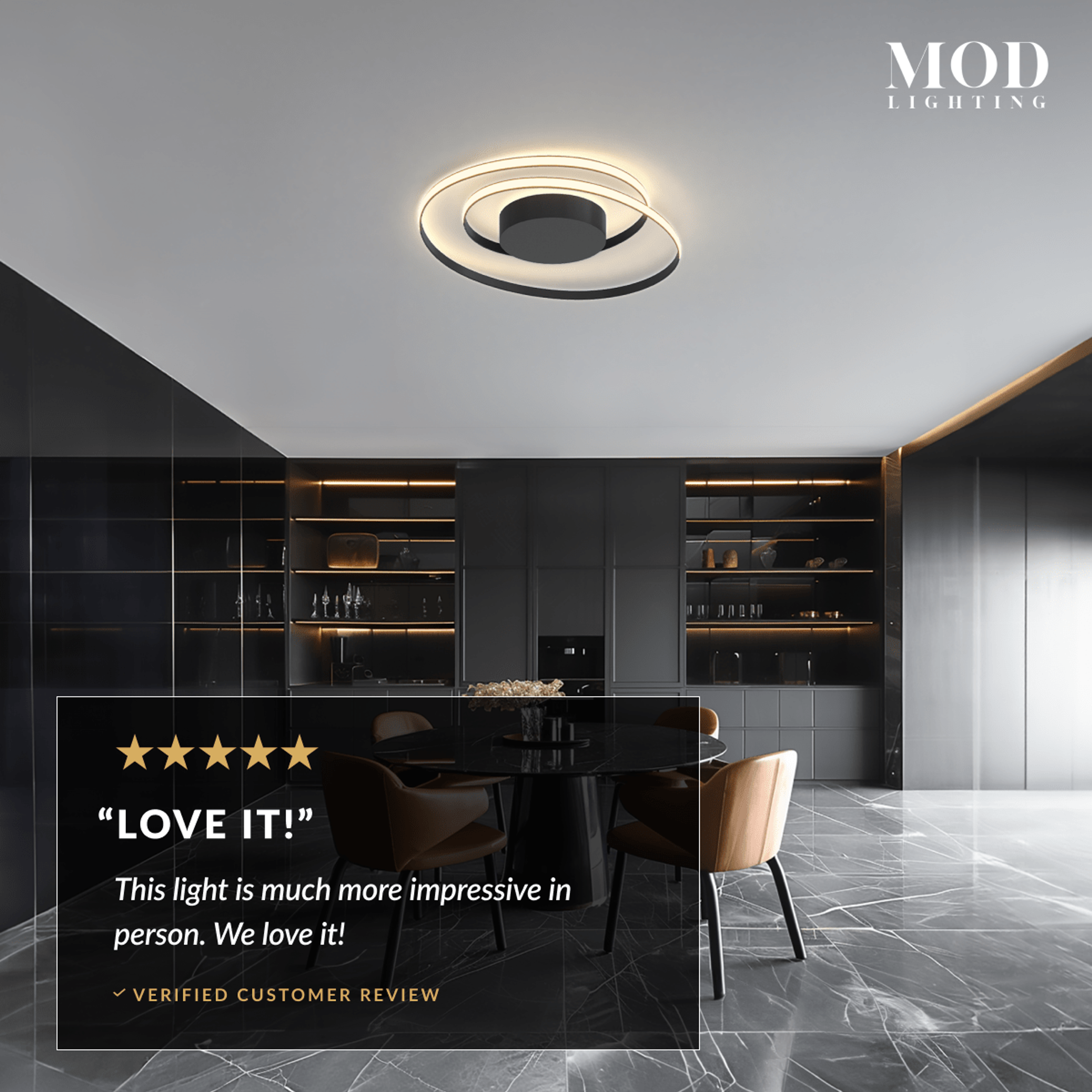 Spiral ceiling light, gold looping LED ring on ceiling above a dining table