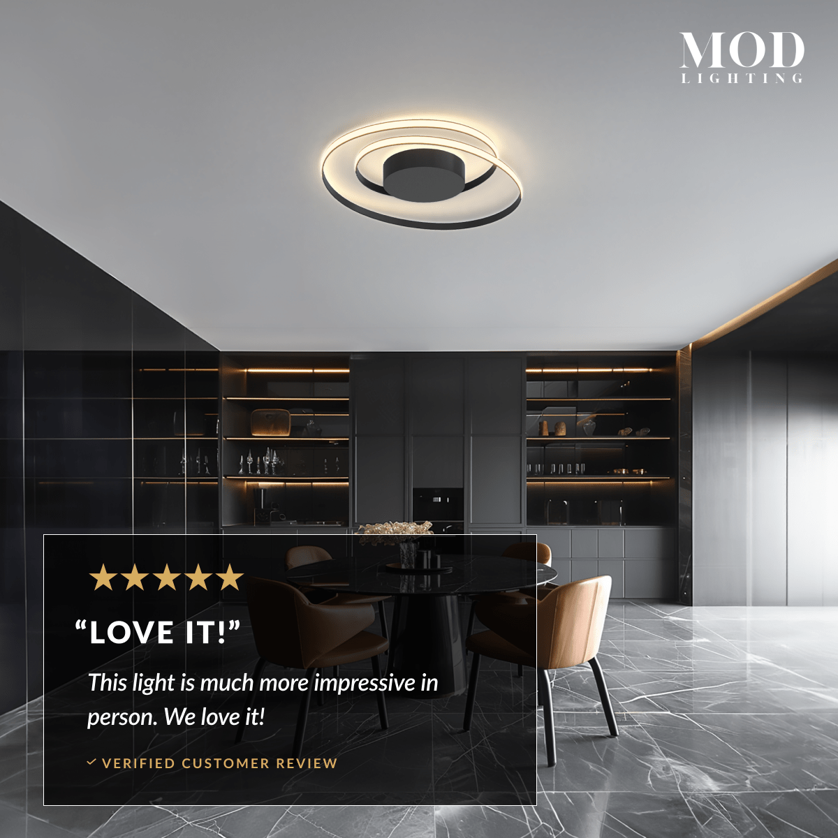 Spiral ceiling light, gold looping LED ring on ceiling above a dining table