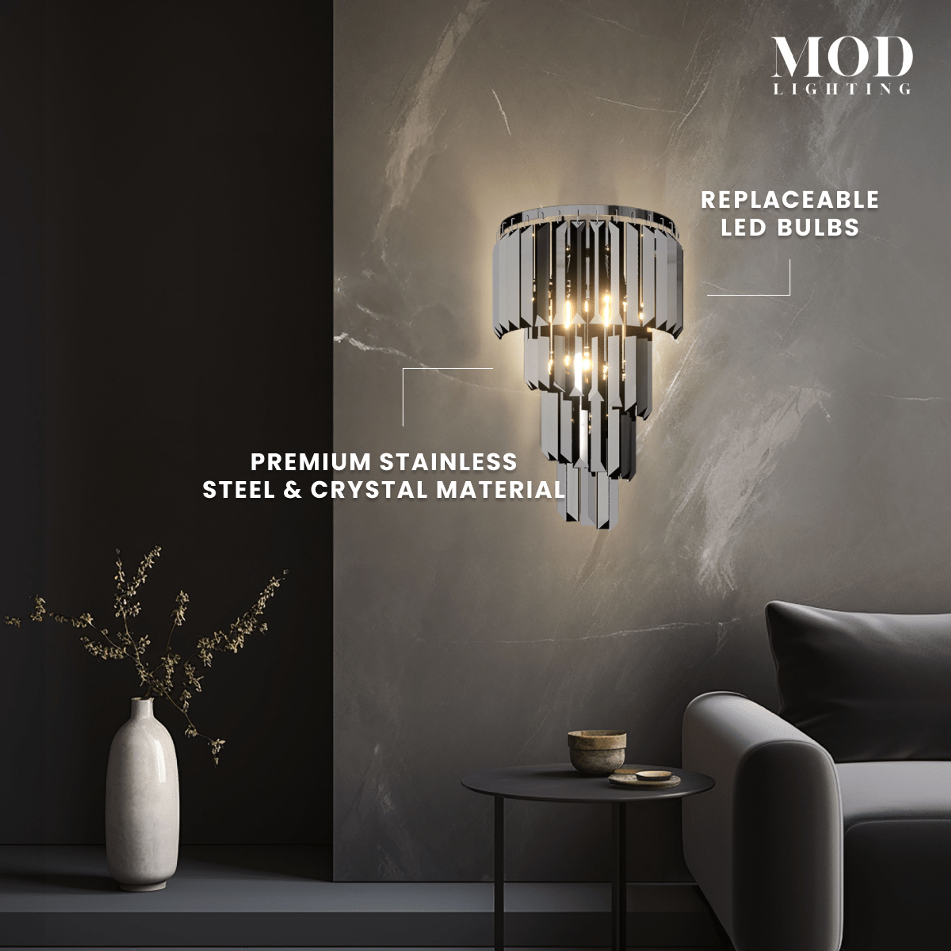 Umbra chrome and crystal tiered sconce on a marble wall, with replaceable LED bulbs and stainless steel build