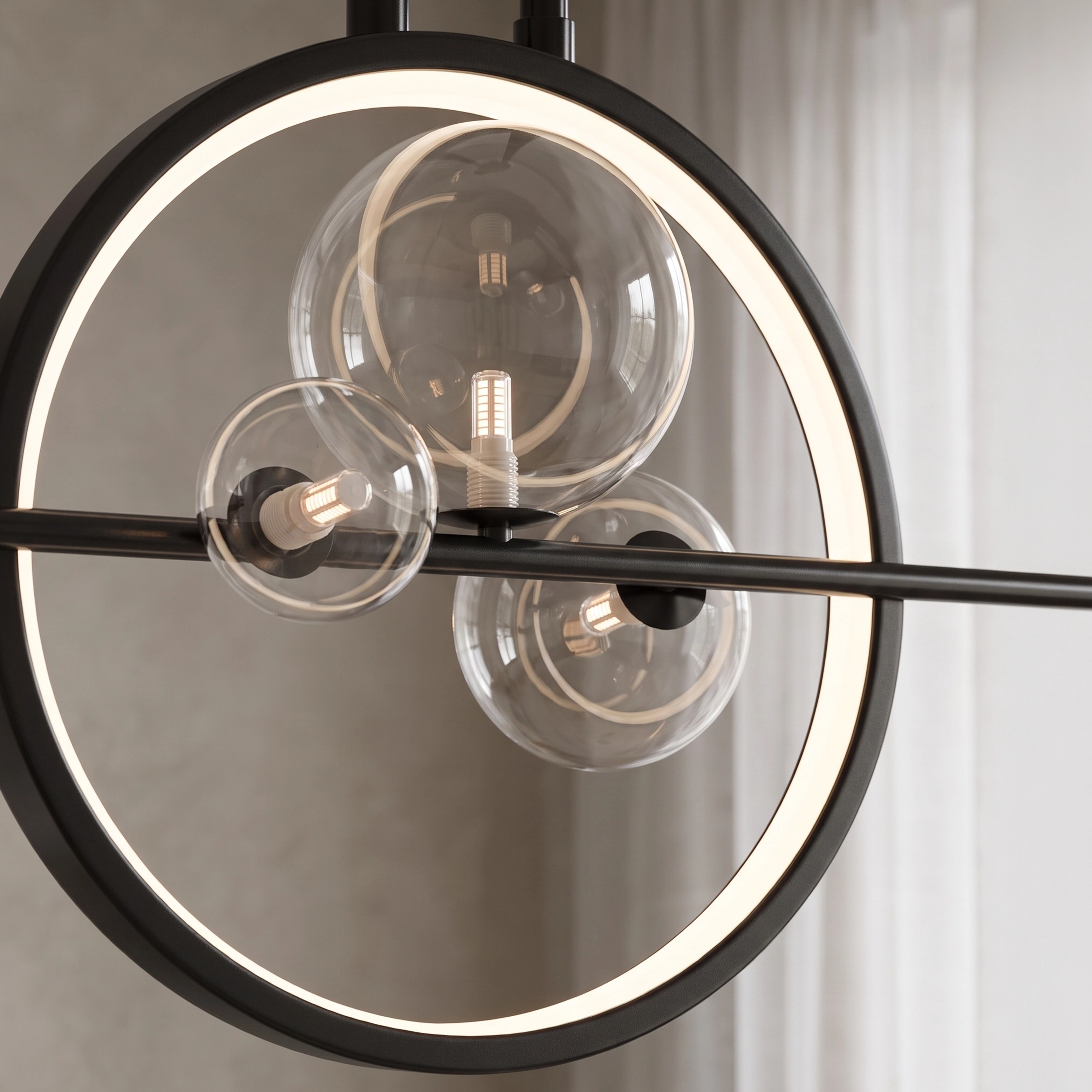 Hailey Nordic chandelier, black bar with gold ring and glass orbs, warm white, over a wood dining table