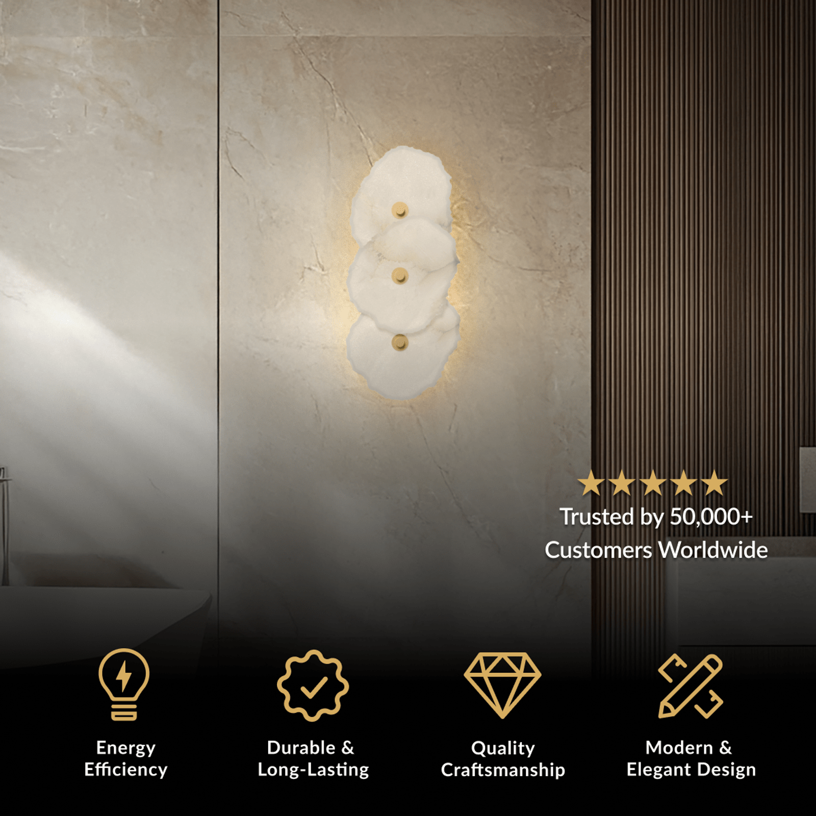 Alba Sconce, stacked white alabaster petal shades with a brushed gold accent on a stone wall