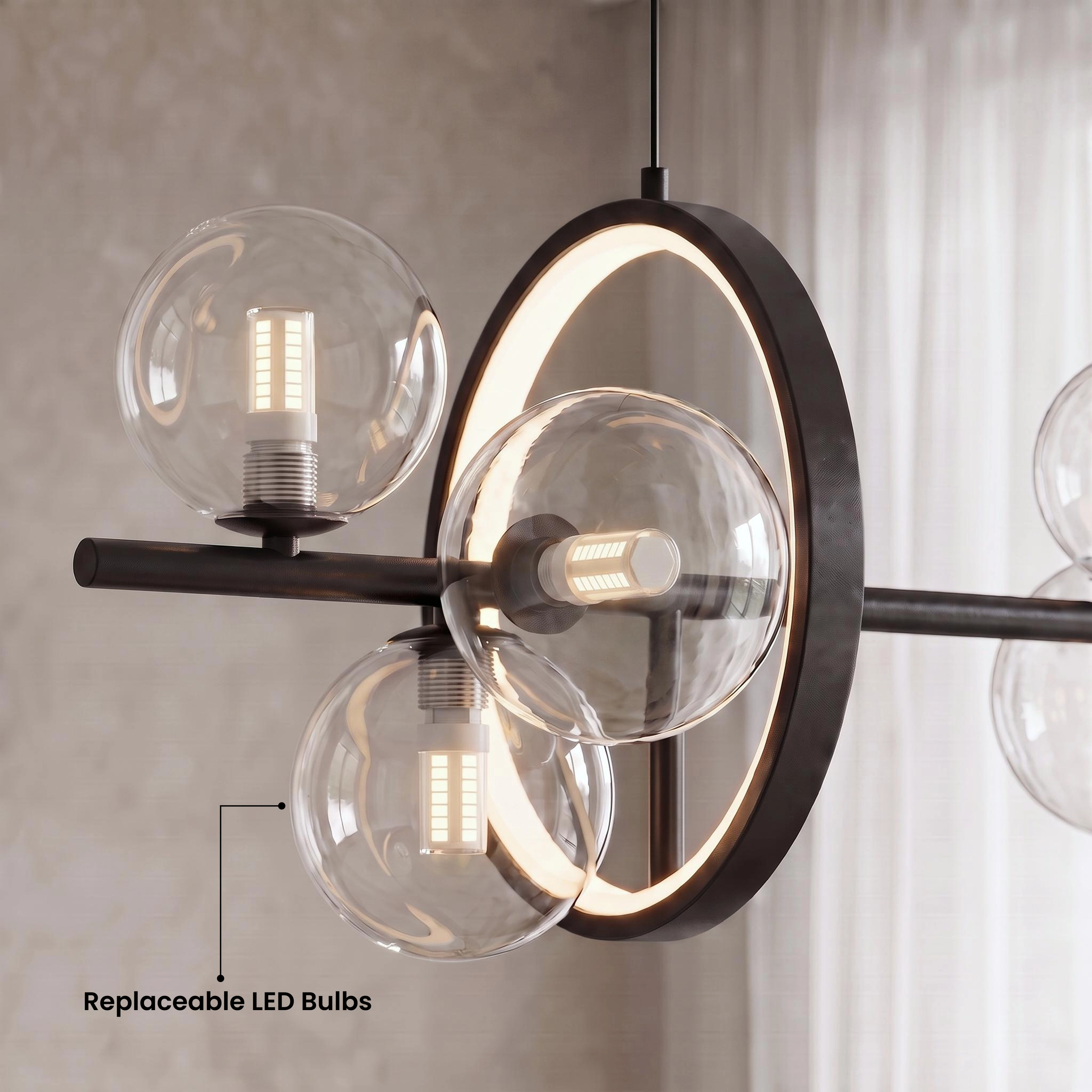 Bailey chandelier in warm white 3000K glow over a living room, black bar with clear glass orbs