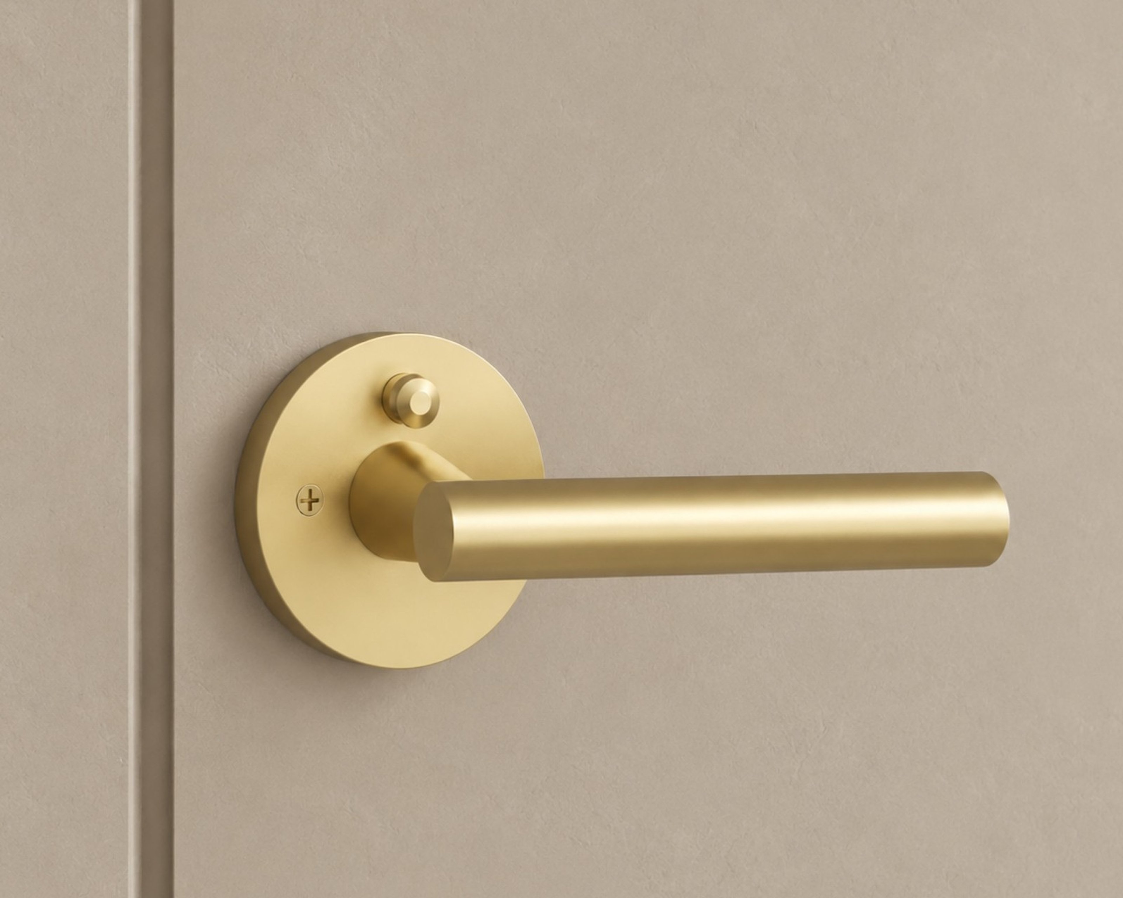 Hendrix brass door handle on a beige door