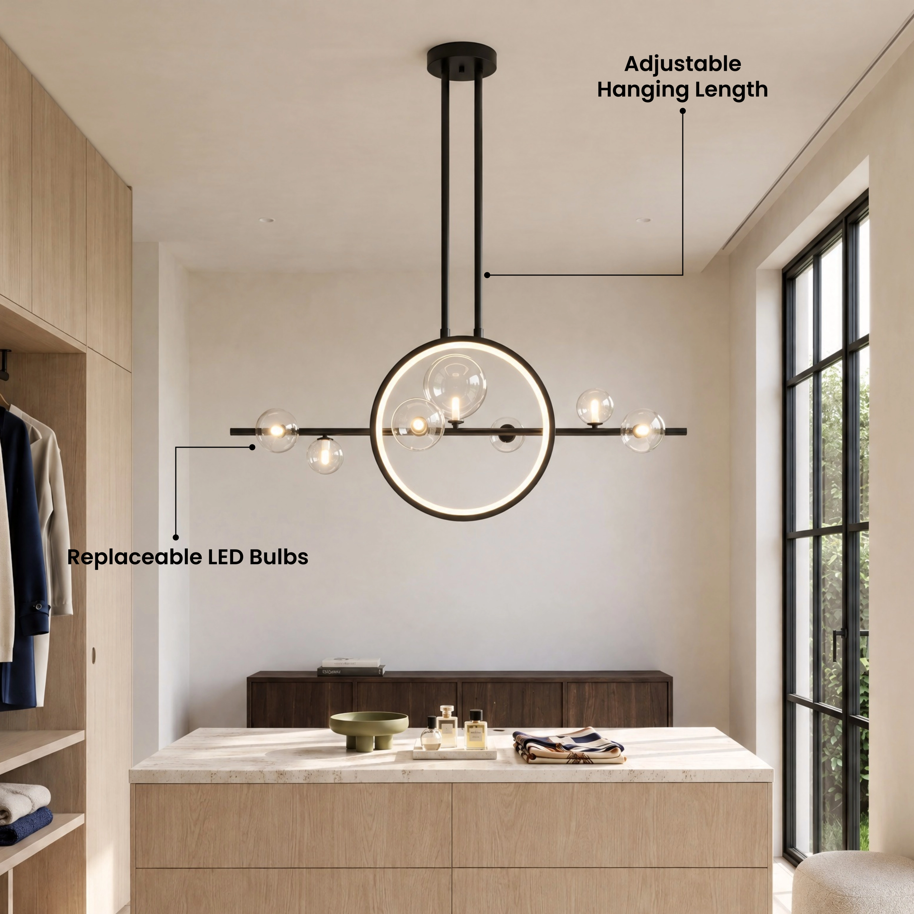 Hailey Nordic chandelier, black bar with gold ring and glass globes, above a dining table by a window