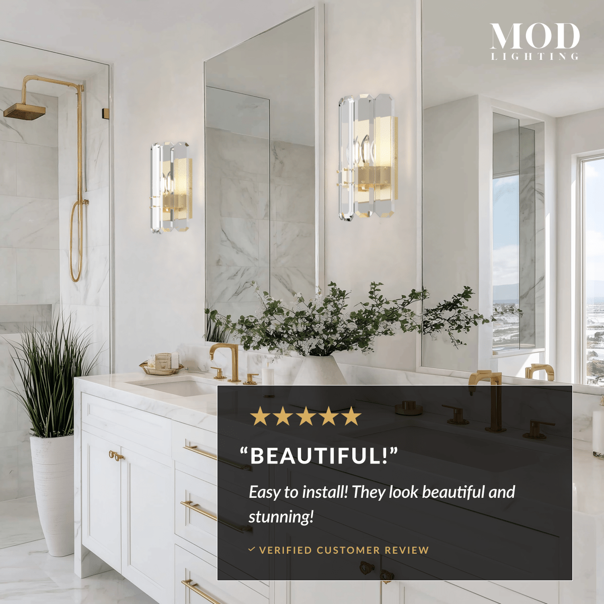 Lustre brushed-gold crystal wall sconces flanking a bathroom vanity mirror