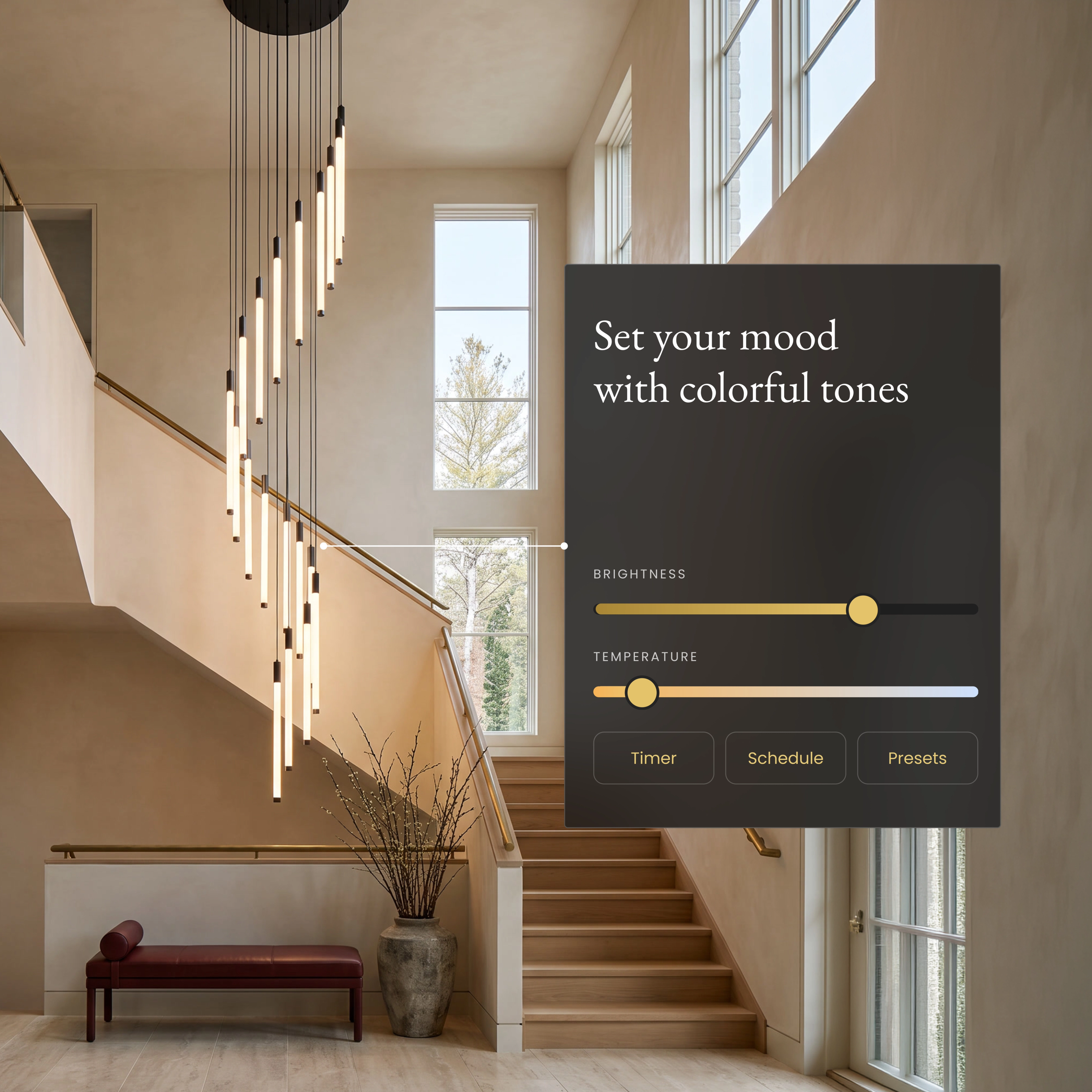Kasper Smart chandelier over a staircase with the app brightness and color temperature sliders