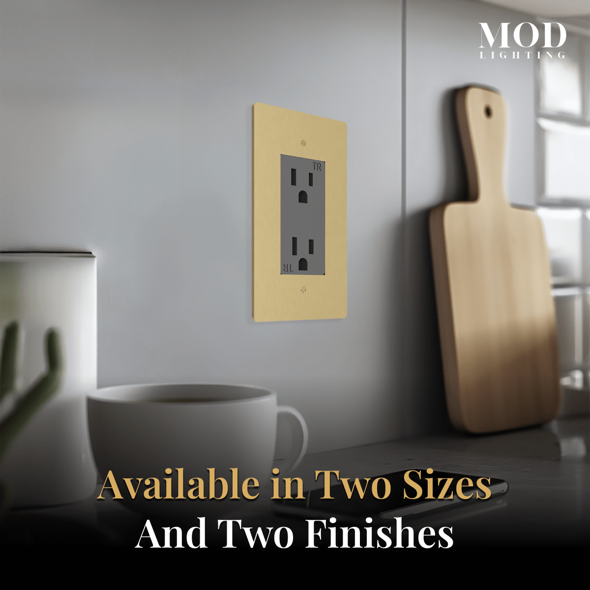 Modern Wall Outlet brushed-gold plate on a grey kitchen wall, noted in two sizes and two finishes