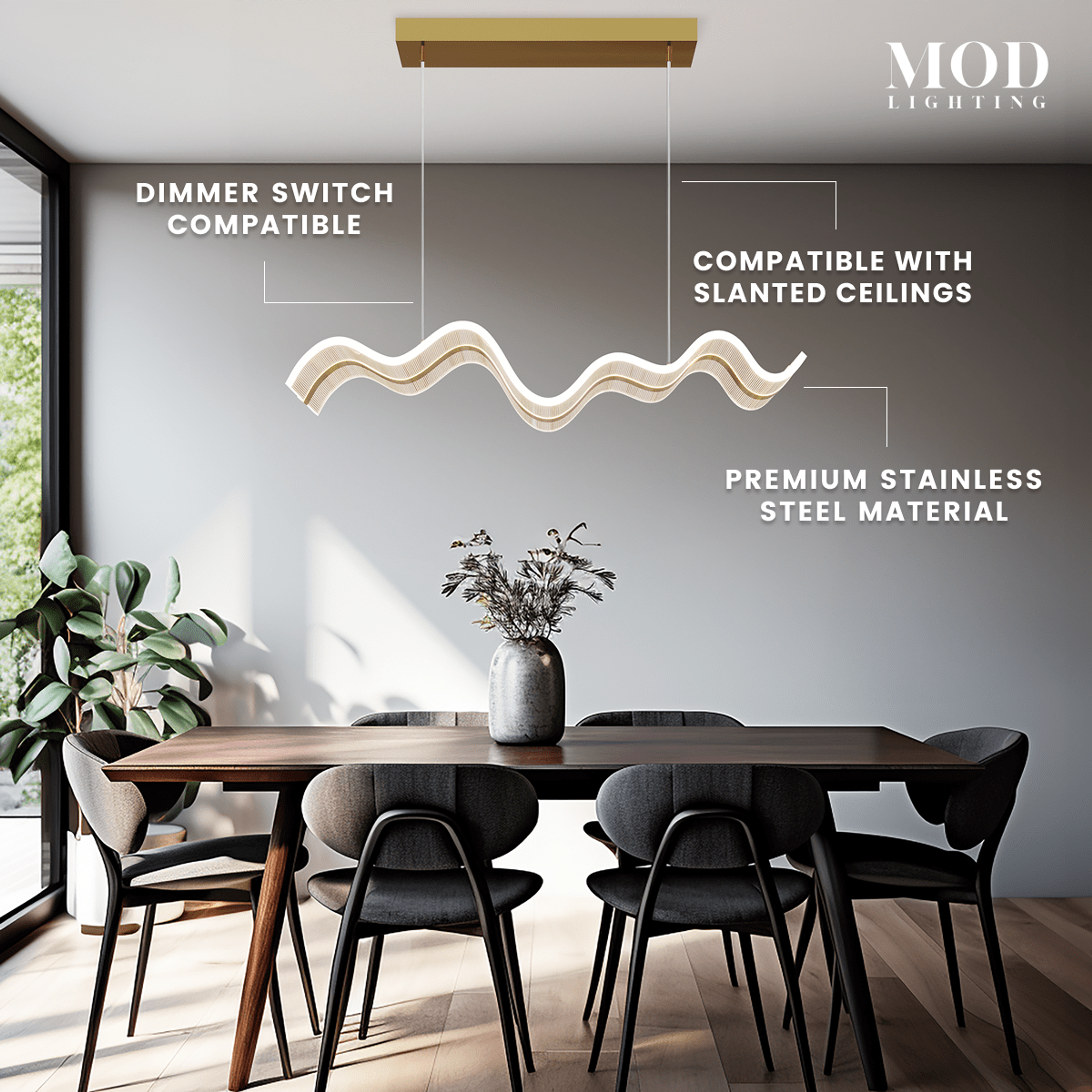 Ribbon gold and frosted wavy linear LED pendant over a walnut dining table; dimmer and slanted-ceiling ready