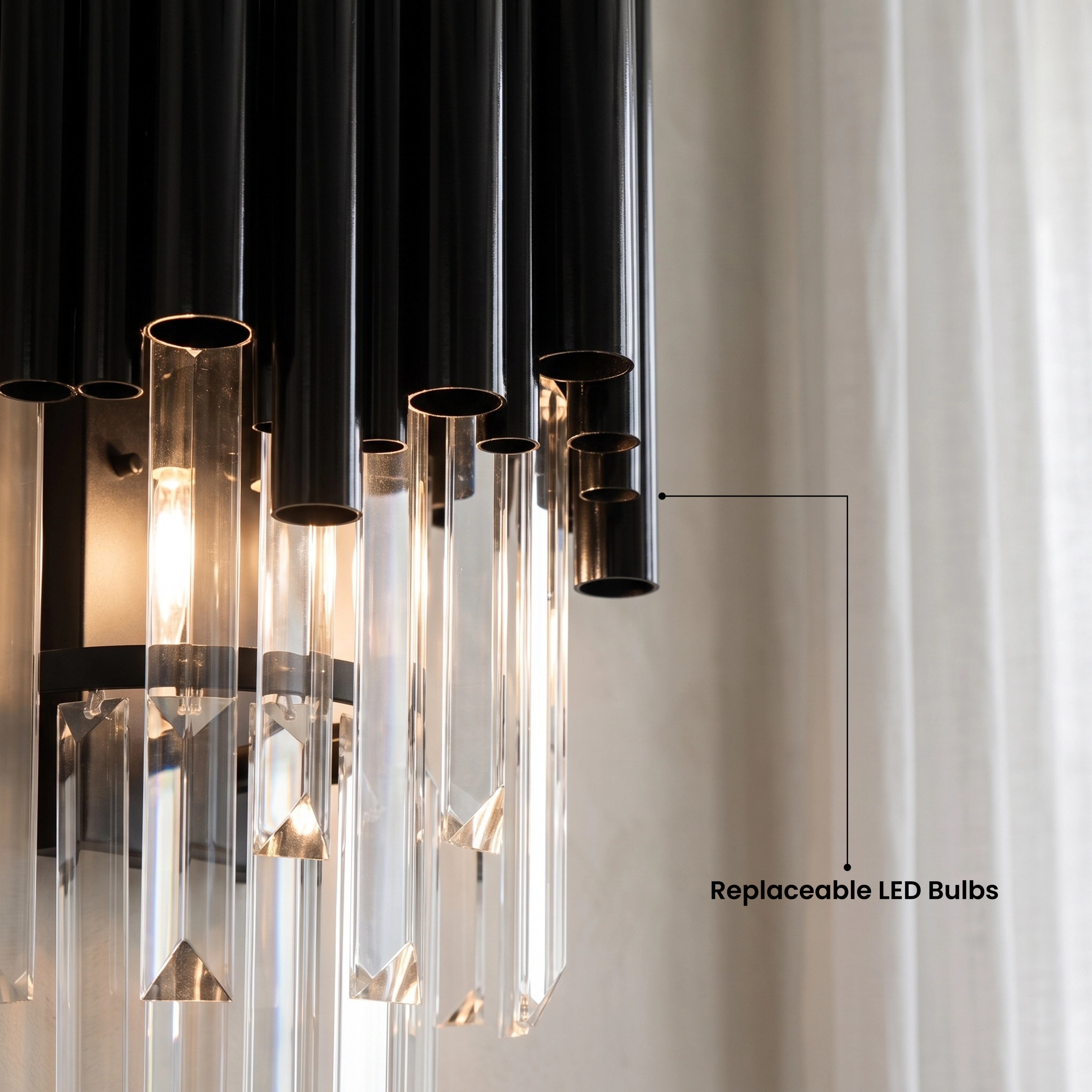 Two Obsidian crystal sconces flanking wall art above a sofa in a grey living room