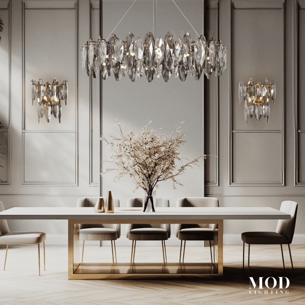 Celestial chandelier, oval chrome frame with clear crystal drops, over a dining table between matching sconces