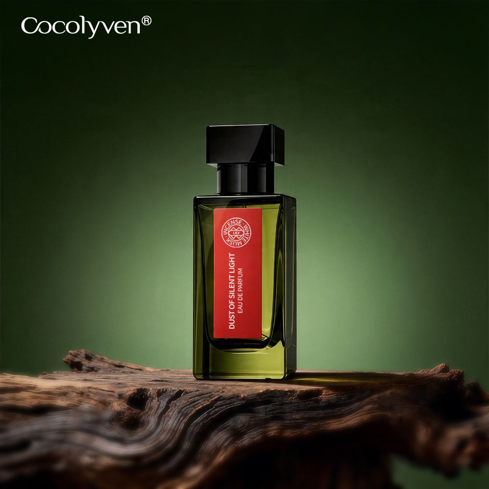 COCOLYVEN Silent Light Dust Perfume 50ml olive-green bottle on dark weathered wood — Guangzhou, China wholesale supply