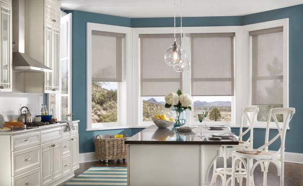 Motorized roller shades in a kitchen