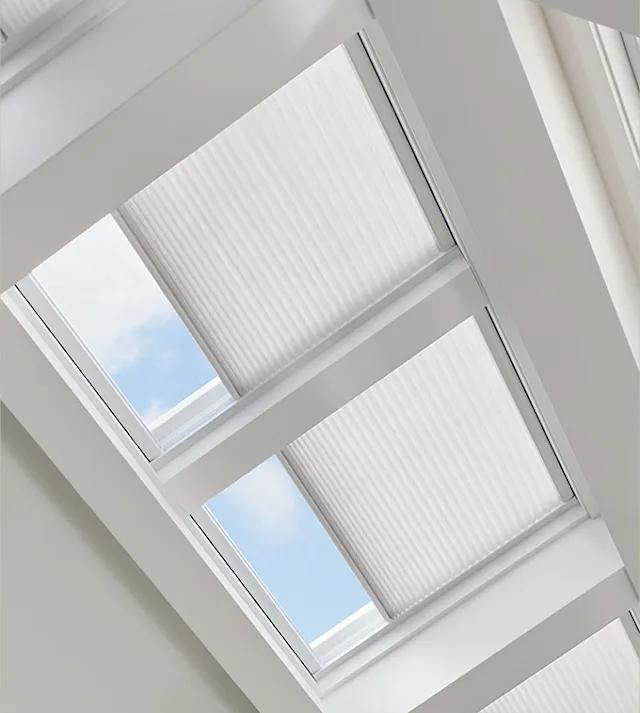 Cellular Shades in Skylights with Light Filtering and Rails