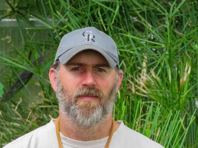 Headshot of Growing Spaces' Production and Installation Manager, Matt Deguise, inside a Growing Dome.
