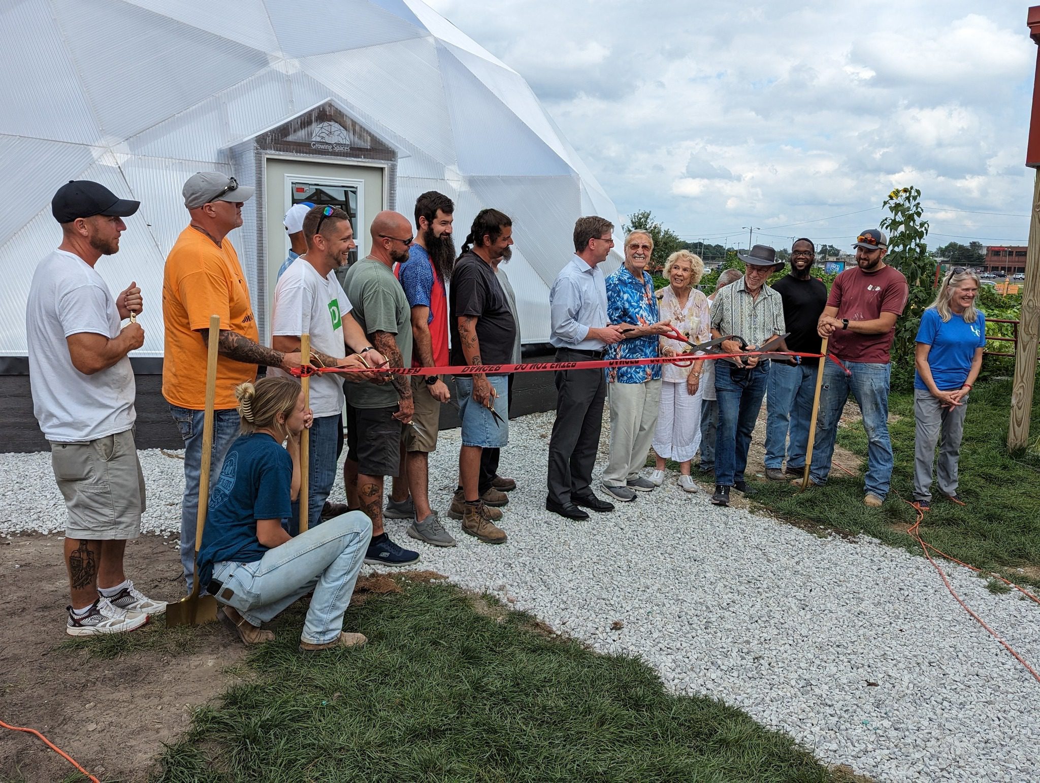 ribbon cutting at a community growing dome greenhouse