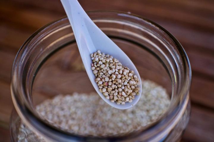 quinoa seeds in a jar close up of a spoon over the jar Pixabay photo