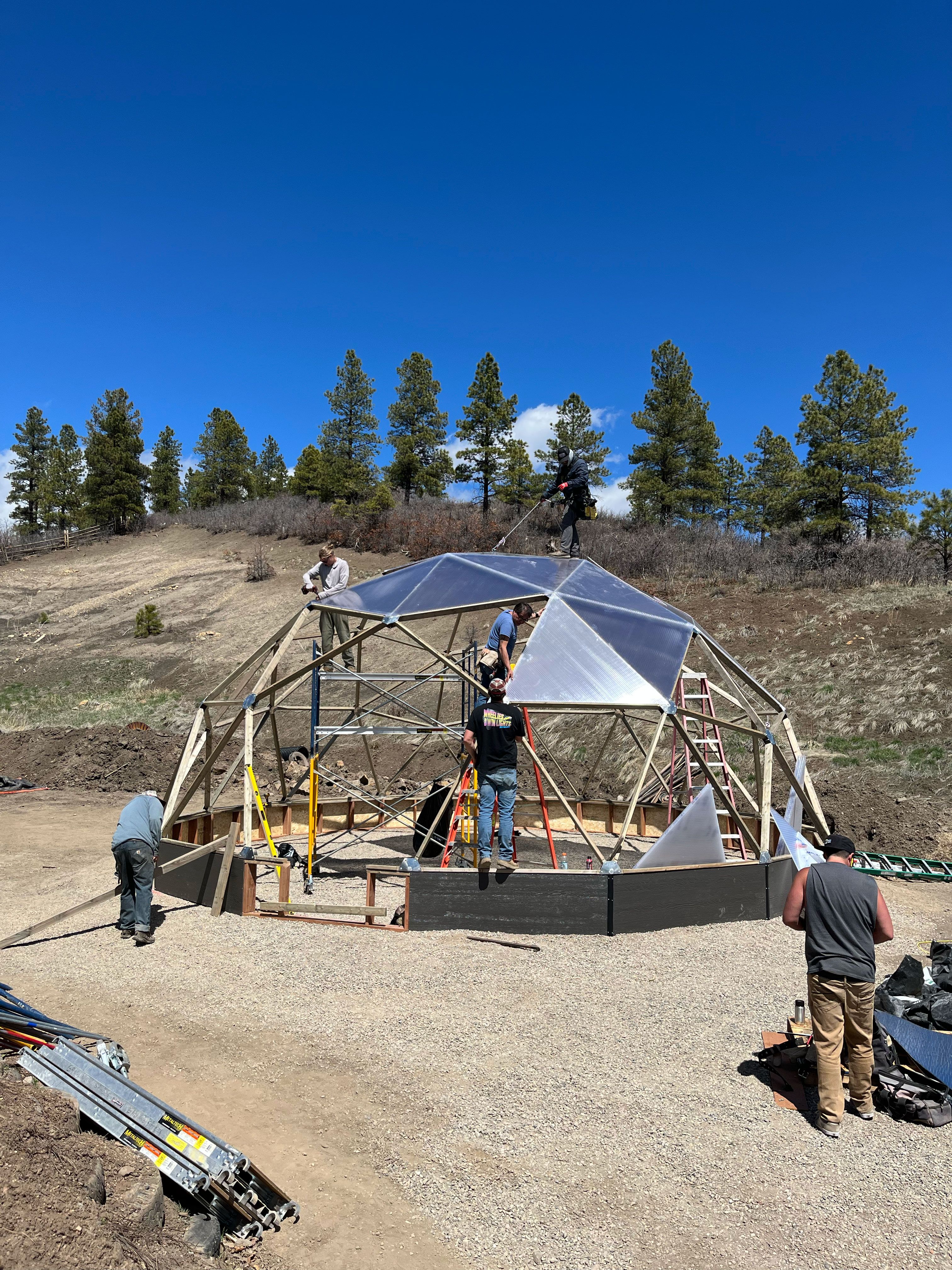crew installing greenhouse