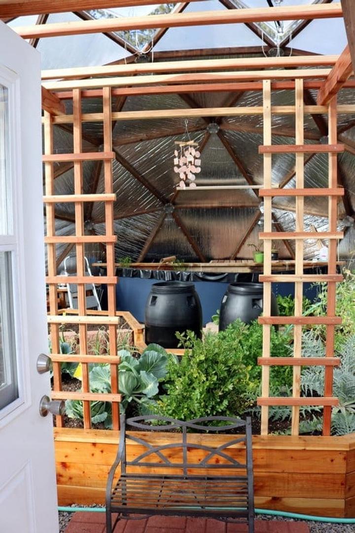 custom redwood trellis in a Growing Dome Greenhouse