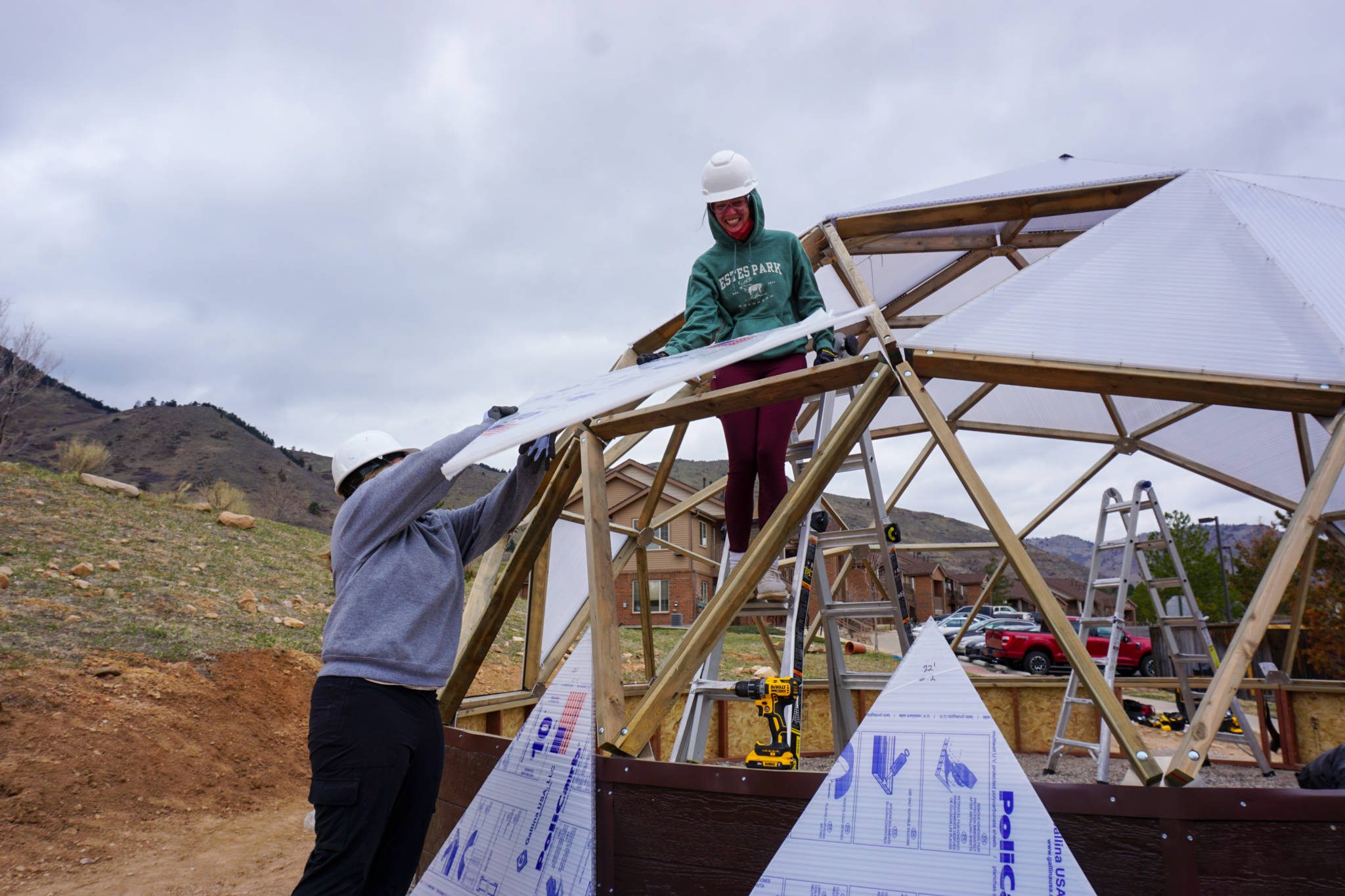 Students helping build a Growing Dome greenhouse