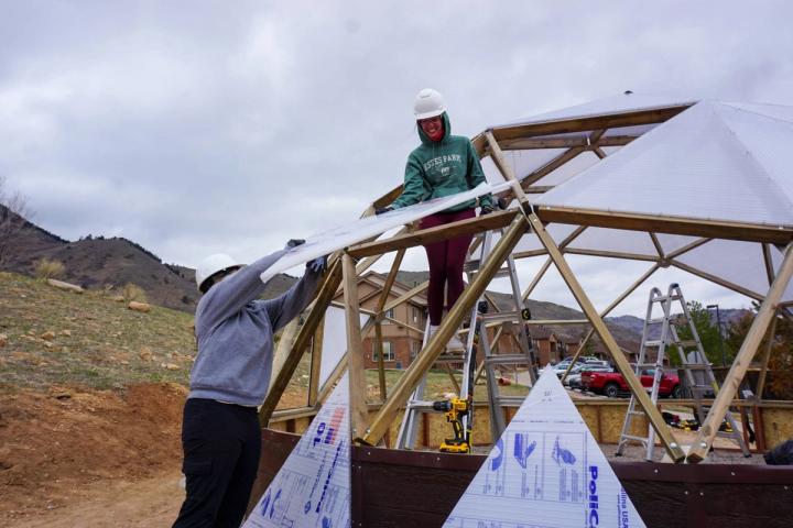 Students helping build a Growing Dome greenhouse