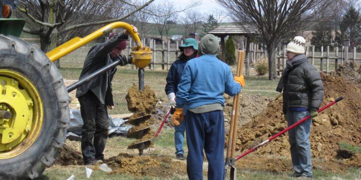 Drilling concrete piers for a Growing Dome greenhouse