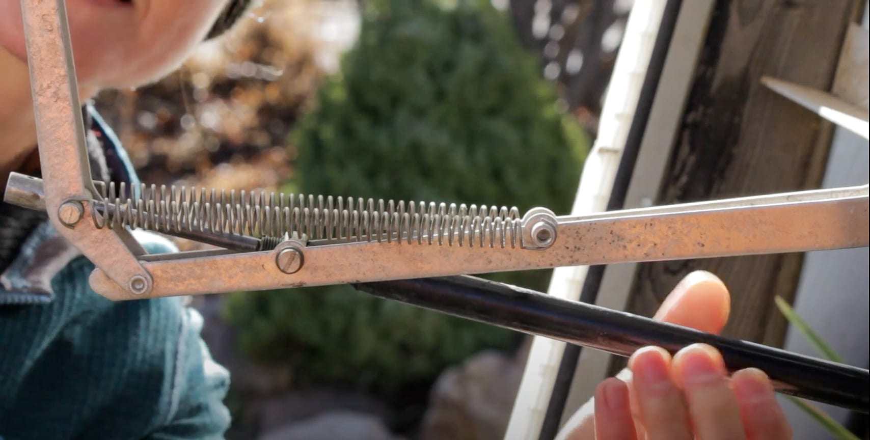 preparing a greenhouse for winter by disengaging vents