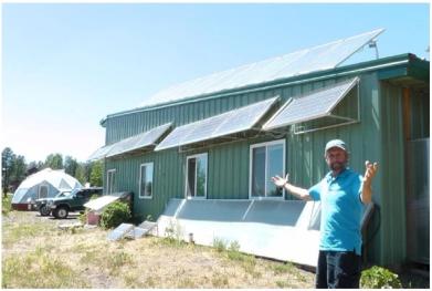 solar panels mounted on south side of manufacturing building