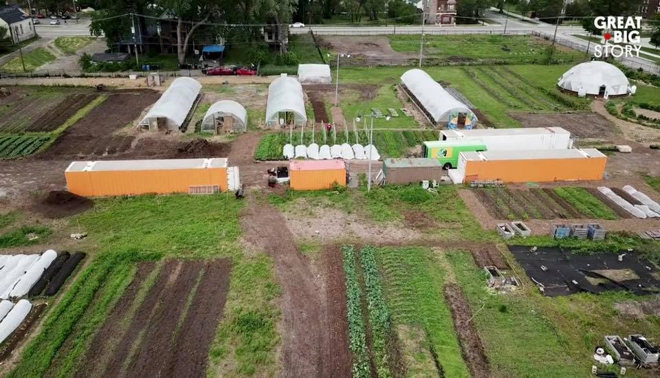 Farm with various greenhouses and outdoor gardens