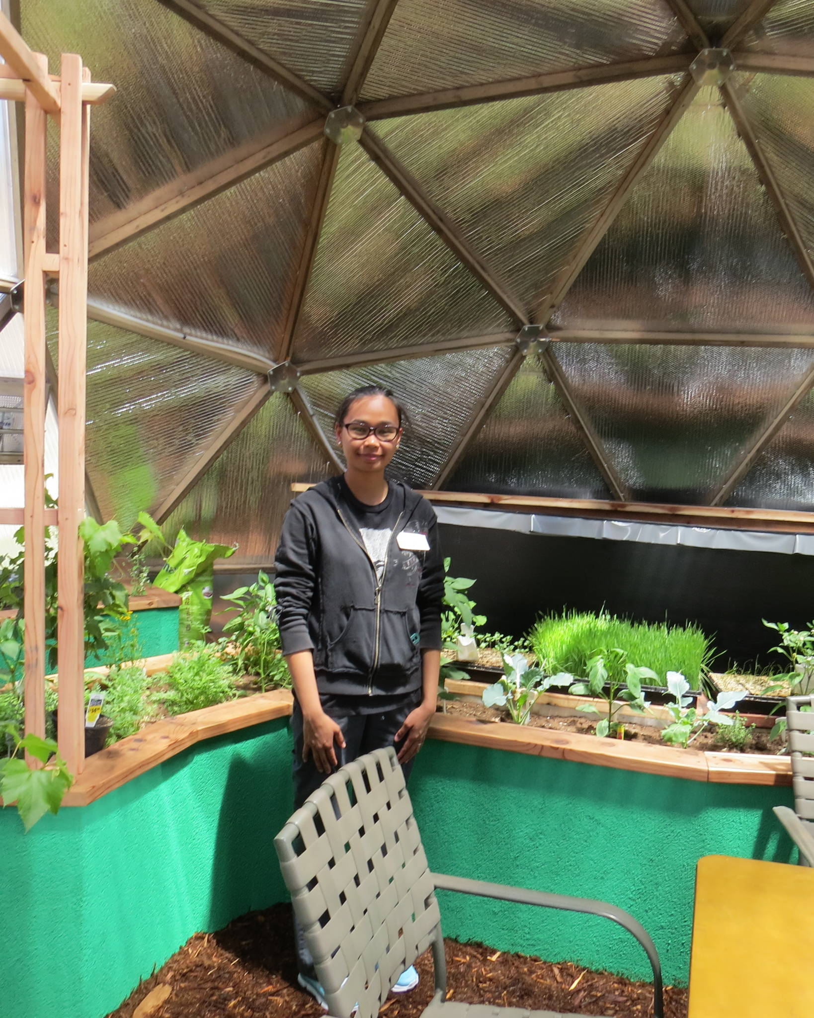 sunshine gardens gardener in the greenhouse