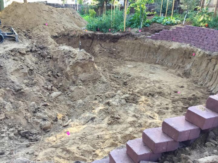 dome site prep with brick wall