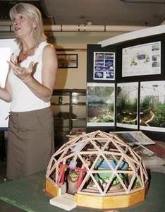 John Nolan/Times photo Joann Vollmer talks to Farmington Gardeners Roundtable in the Goodwin Library about the benefits of geodesic domes for growing vegetables year-round. A model of her 33-foot diameter dome is in the foreground.