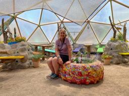 Rachel in her She Shed Greenhouse