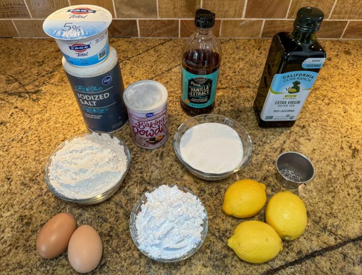 ingredients for lemon olive oil cake laid out on the table
