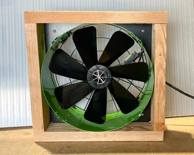 quietcool 12v hybrid fan in a wooden frame