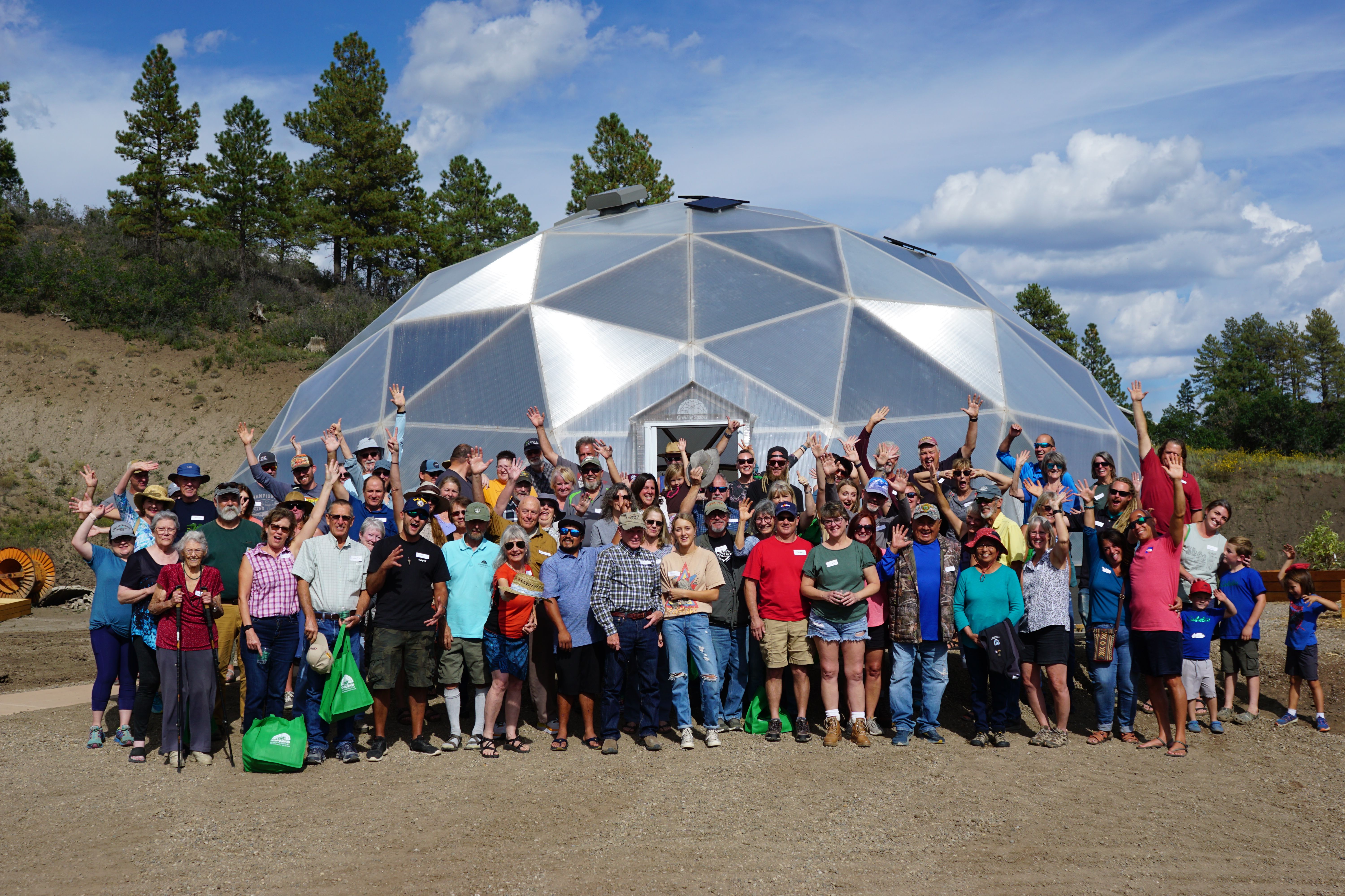 Growing Spaces customers in front of a Growing Dome