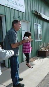 Growing Spaces employee playing with a visitor