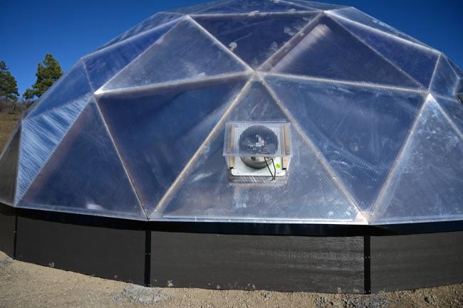 solar powered intake fan from the exterior of a geodesic greenhouse